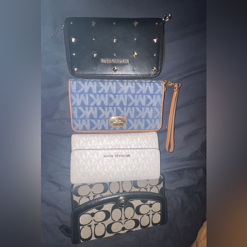 3 Michael Kors and 1 coach wallet
